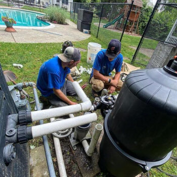 pool-plumbing-pipework-technician Pool technician repairing pool plumbing and pipework